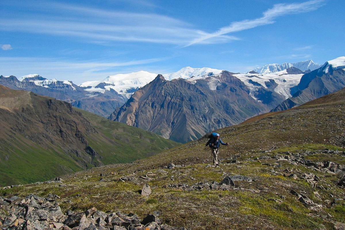 A backpacker hikes The Goat Trail in Wrangell-St. Elias National Park, Alaska.