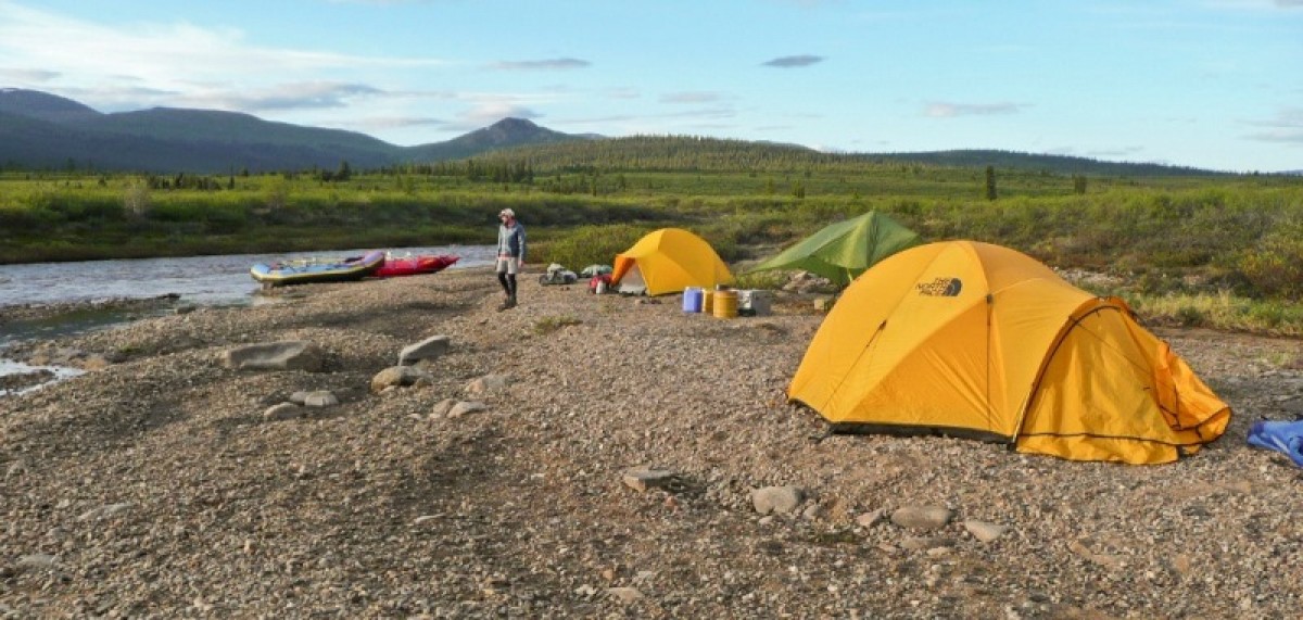 A group sets up camp along the Charley River while rafting Yukon - Charley Rivers National Preserve.