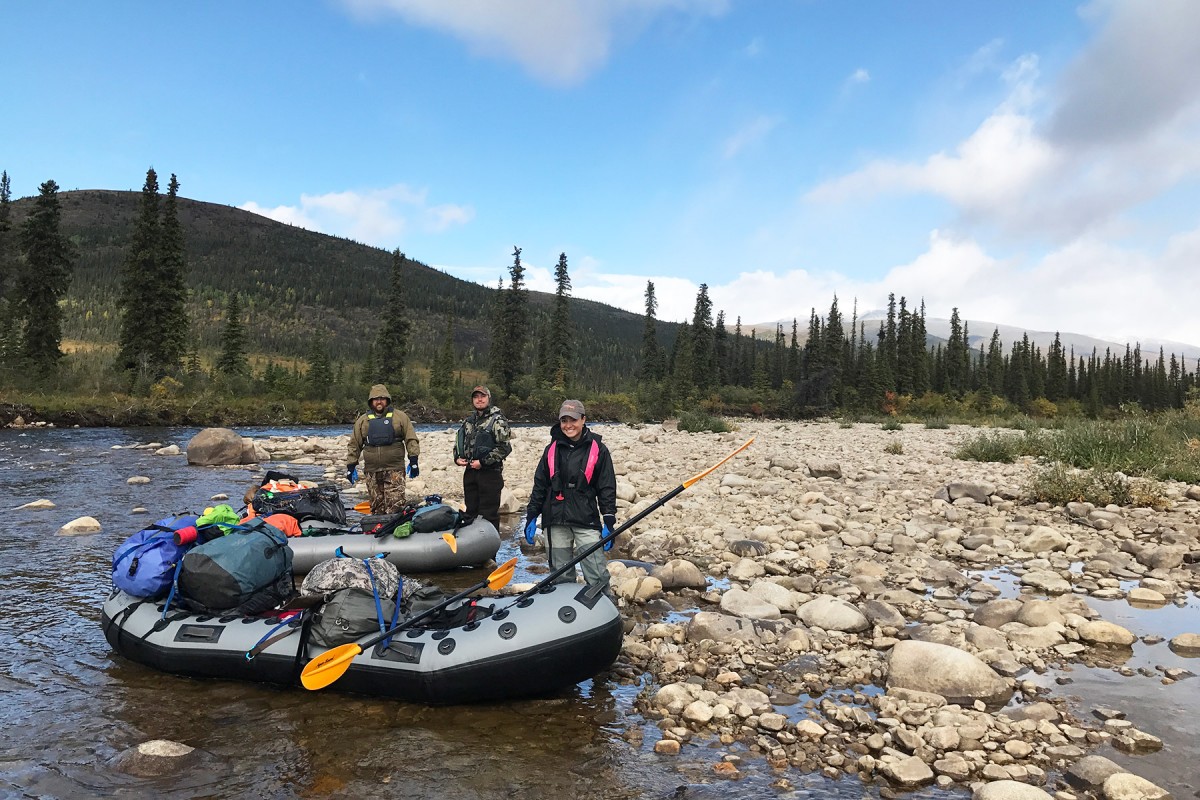 A group if fully loaded for rafting the Charley River.