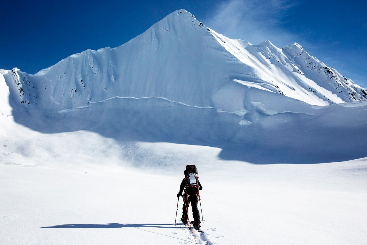 An A/T skier makes his way through the Alaska backcountry of the Chugach Mountains, toward Pyramid outside of Valdez.