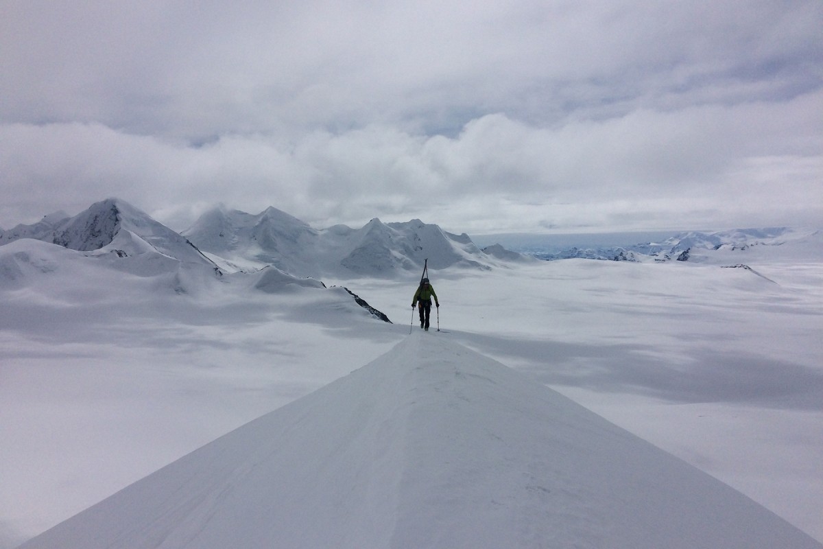 Taylor Brown climbs Megamid Peak.