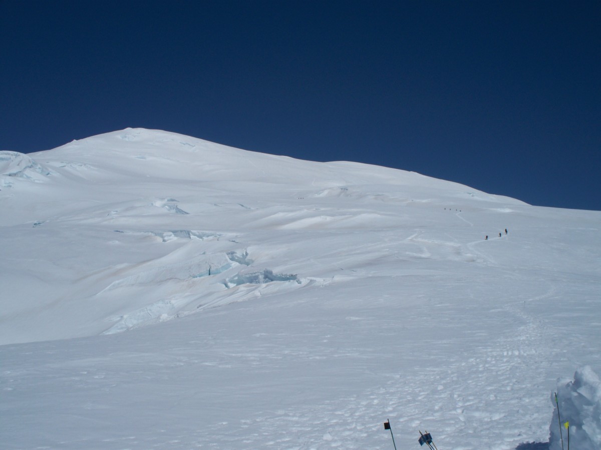 Looking up at climbers on Mt. Jarvis from camp.